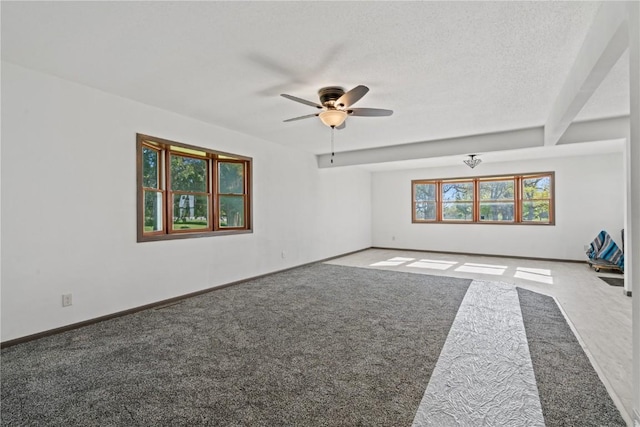 6119 28th Ave Dr, Vinton, IA 52349 - unfurnished room featuring ceiling fan, carpet, and baseboards