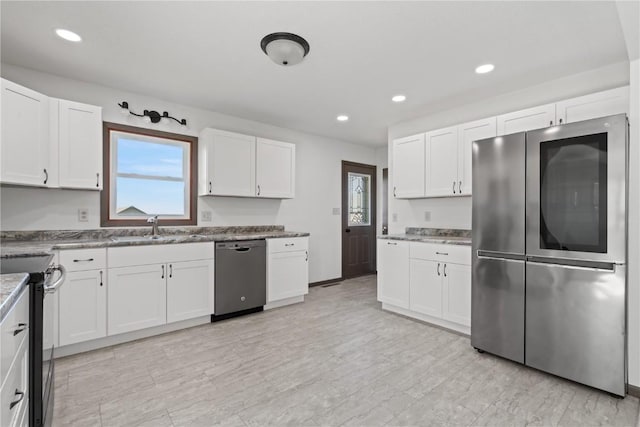 6119 28th Ave Dr, Vinton, IA 52349 - kitchen featuring smart refrigerator, dishwashing machine, a sink, black range with electric cooktop, and plenty of natural light