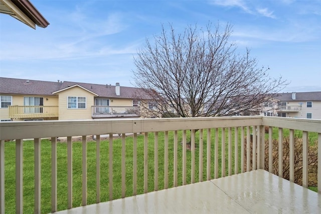3912 Summerfield Ln NE Unit C, Cedar Rapids, IA 52402 - wooden deck featuring a residential view and a lawn