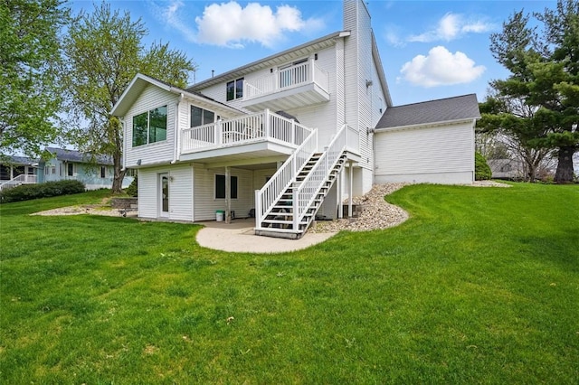 1659 Apache Dr NE, Solon, IA 52333 - rear view of property with a yard, a wooden deck, stairway, and a chimney