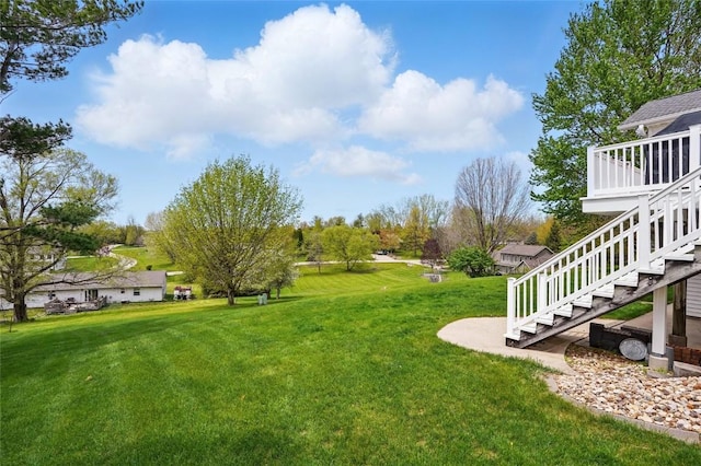 1659 Apache Dr NE, Solon, IA 52333 - view of grassy yard with stairway and a deck