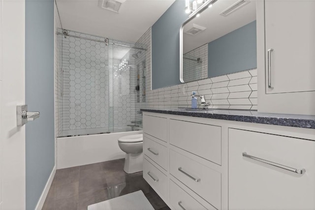 1659 Apache Dr NE, Solon, IA 52333 - bathroom with shower / bath combination with glass door, vanity, tile patterned flooring, and backsplash