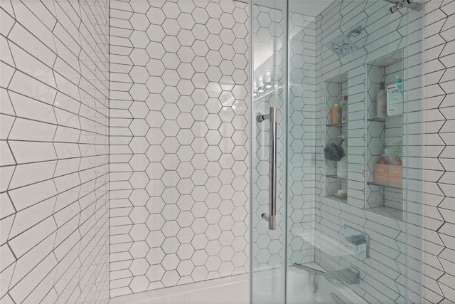 1659 Apache Dr NE, Solon, IA 52333 - bathroom featuring shower / bath combination with glass door