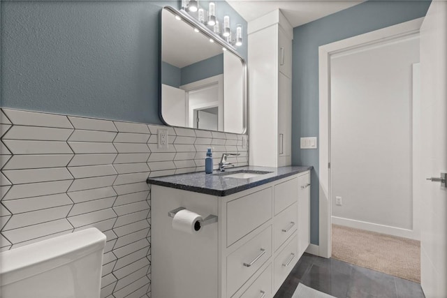 1659 Apache Dr NE, Solon, IA 52333 - bathroom with vanity and tile walls