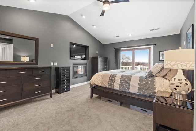 1659 Apache Dr NE, Solon, IA 52333 - bedroom with light colored carpet, a ceiling fan, access to outside, and high vaulted ceiling