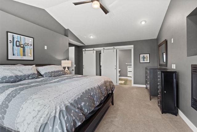 1659 Apache Dr NE, Solon, IA 52333 - bedroom with vaulted ceiling, light carpet, ceiling fan, and a barn door