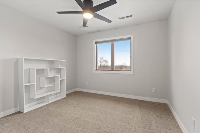 1659 Apache Dr NE, Solon, IA 52333 - spare room featuring carpet flooring and a ceiling fan