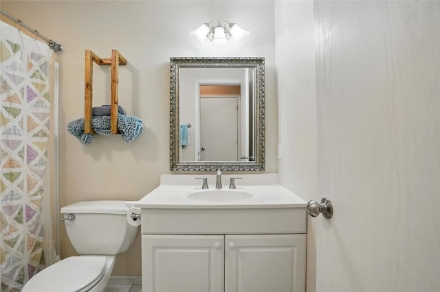 bathroom featuring vanity, toilet, a shower with curtain, and baseboards
