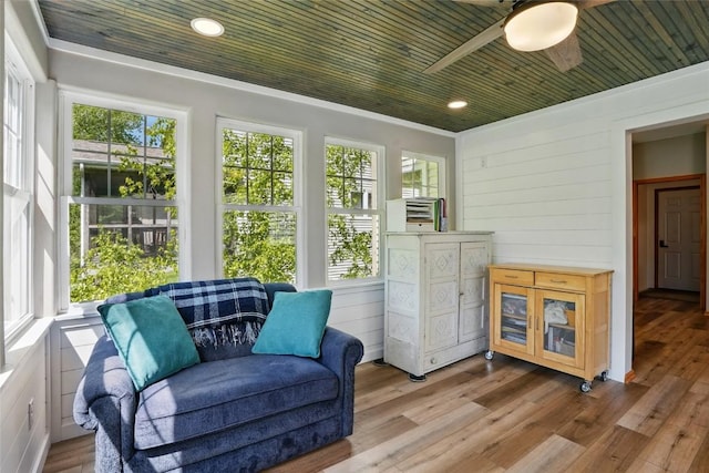 sunroom / solarium featuring healthy amount of natural light