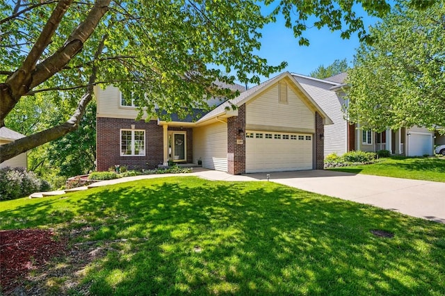 view of front of house with an attached garage, brick siding, a front yard, and driveway