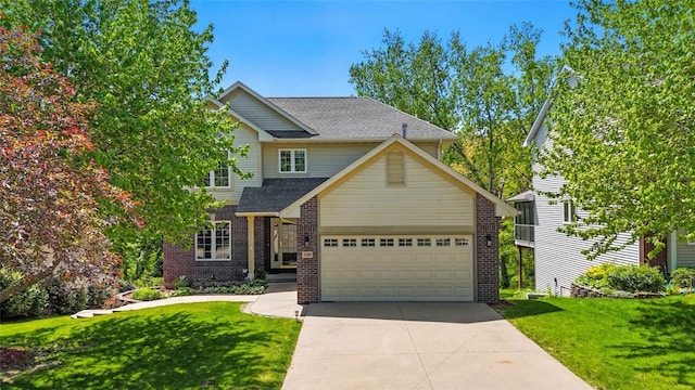 view of front of property featuring a front lawn, brick siding, and concrete driveway