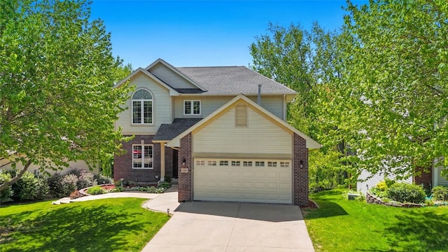 traditional home featuring driveway, a front yard, an attached garage, brick siding, and a shingled roof