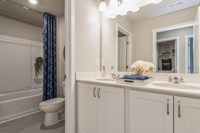 721 Thomas St, Tiffin, IA 52340 - bathroom with toilet, double vanity, and shower / bathtub combination with curtain