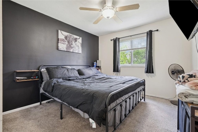 906 W 18th St, Vinton, IA 52349 - carpeted bedroom with ceiling fan and baseboards