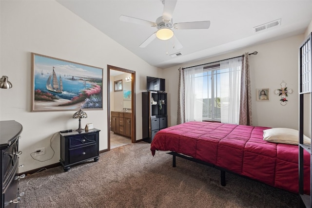 bedroom featuring carpet, vaulted ceiling, ensuite bathroom, ceiling fan, and baseboards