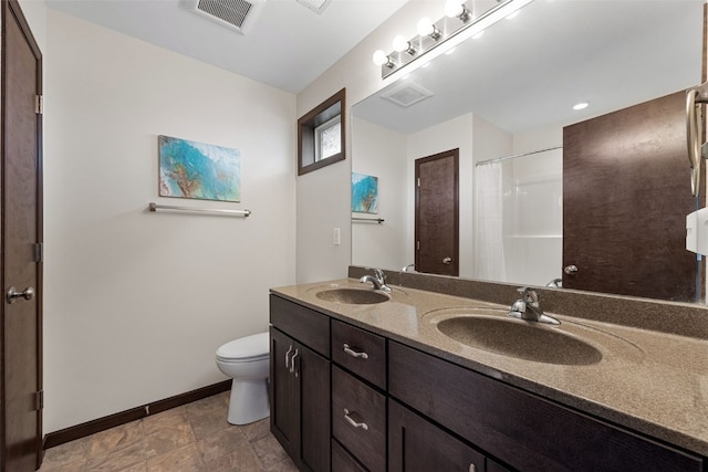 bathroom featuring baseboards, toilet, double vanity, and a shower with shower curtain