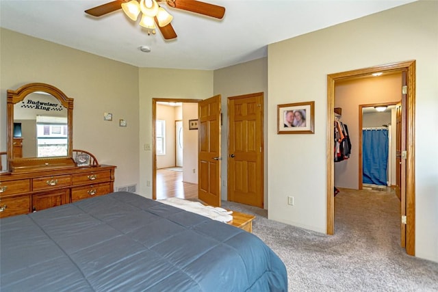 1100 Vernon Hill Blvd, Cedar Rapids, IA 52403 - carpeted bedroom with multiple windows and a ceiling fan