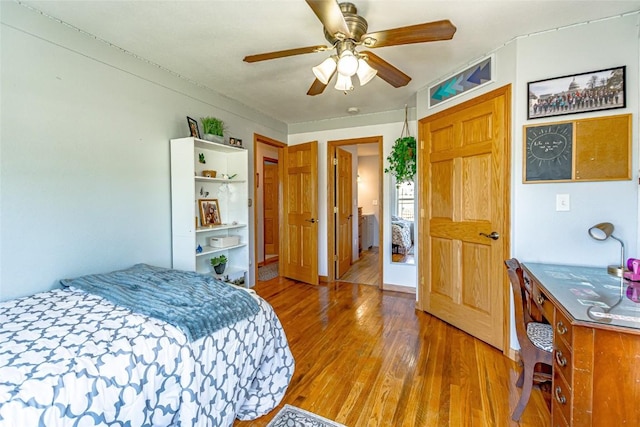 1100 Vernon Hill Blvd, Cedar Rapids, IA 52403 - bedroom with wood finished floors and a ceiling fan