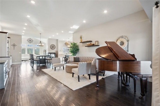 living room featuring wood-type flooring and recessed lighting