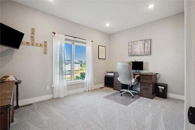 carpeted office space featuring baseboards and recessed lighting