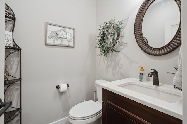 bathroom with toilet and vanity