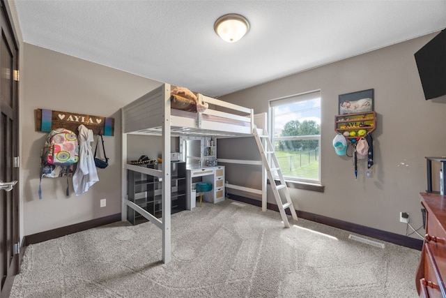 carpeted bedroom with baseboards