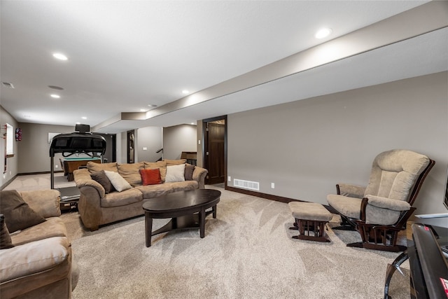living area featuring light colored carpet, baseboards, and recessed lighting