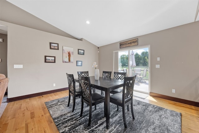 dining area with lofted ceiling, baseboards, light wood-style floors, and recessed lighting