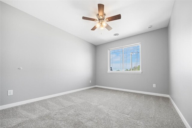4803 Dostal Ct, Cedar Rapids, IA 52404 - unfurnished room with carpet floors, a ceiling fan, and baseboards