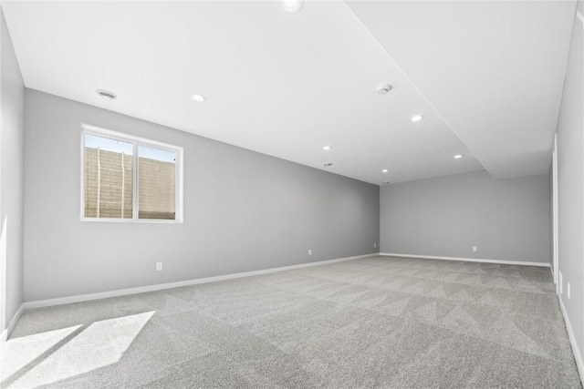 4803 Dostal Ct, Cedar Rapids, IA 52404 - unfurnished room with light carpet, baseboards, and recessed lighting