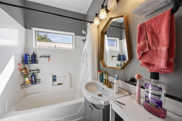 507 2nd St E, Newhall, IA 52315 - full bath with healthy amount of natural light, a sink, and shower / bath combination with curtain
