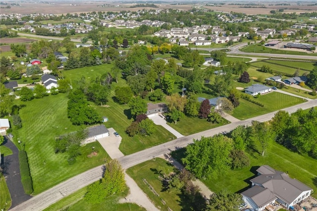 aerial view of property and surrounding area with nearby suburban area