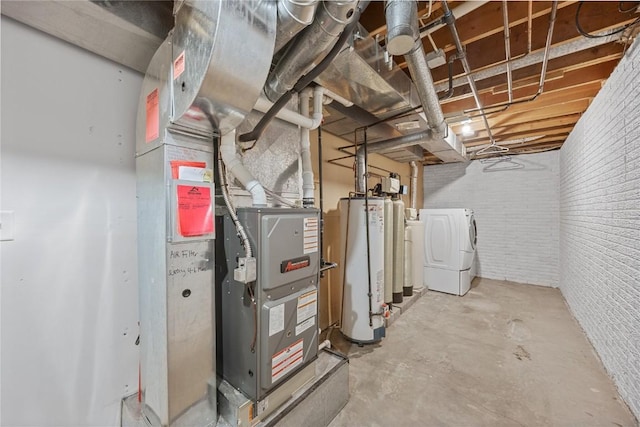 utilities featuring washing machine and clothes dryer and gas water heater