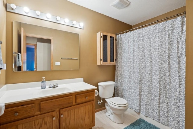 full bath with toilet, vanity, tile patterned floors, and a shower with curtain