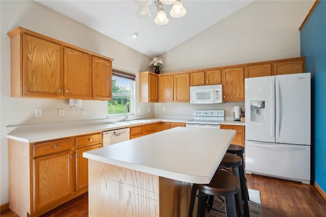 kitchen featuring white appliances, a sink, a chandelier, light countertops, and high vaulted ceiling