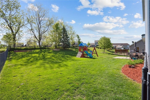 view of jungle gym featuring a patio