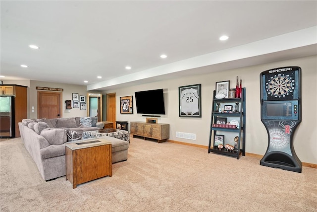 living room featuring light colored carpet, recessed lighting, and baseboards