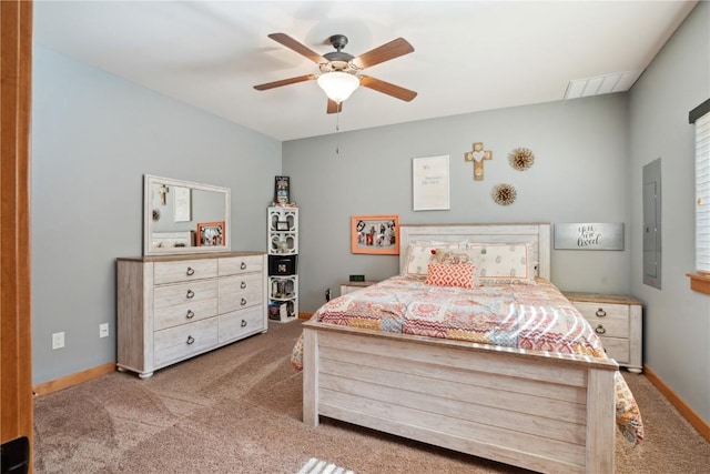 carpeted bedroom with baseboards, a ceiling fan, and electric panel