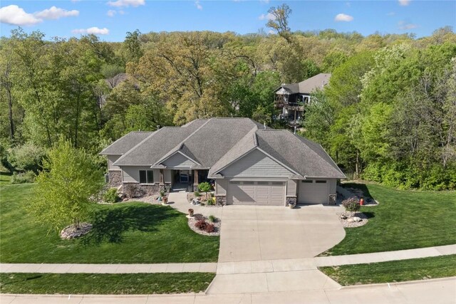 view from above of property with a heavily wooded area