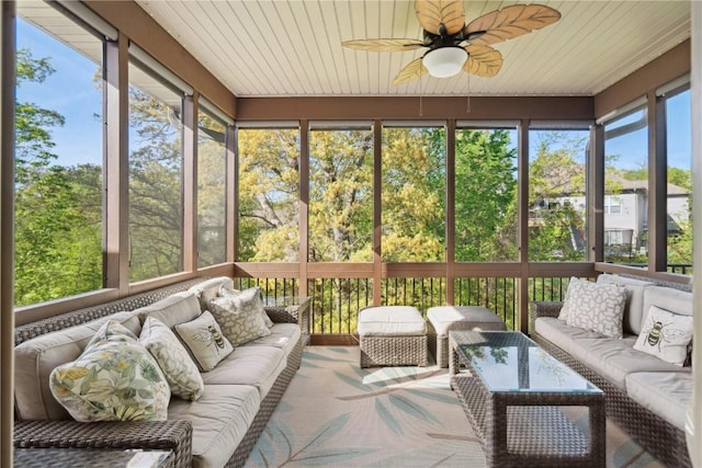 sunroom with an outdoor living space and ceiling fan