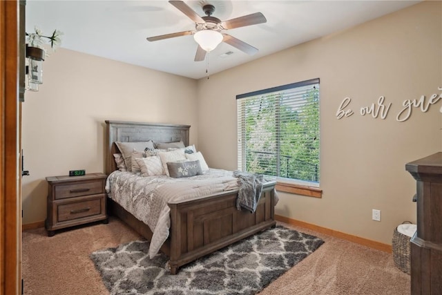 bedroom featuring carpet, baseboards, and a ceiling fan