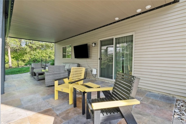 view of patio featuring fence