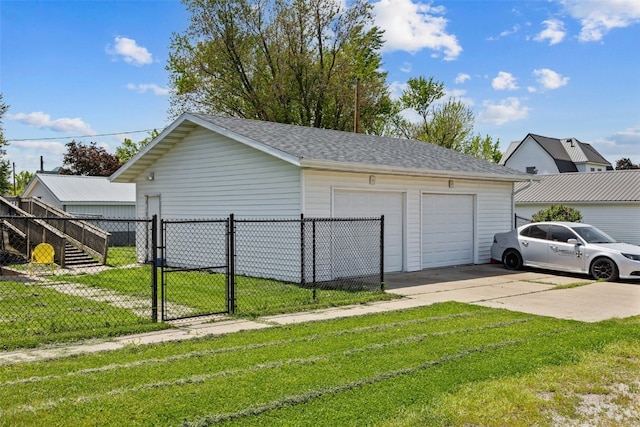 detached garage featuring a gate