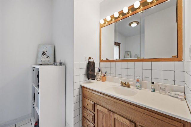 bathroom featuring vanity and decorative backsplash