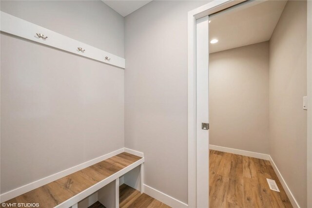 2740 Burns Dr, Marion, IA 52302 - mudroom featuring baseboards, wood finished floors, and recessed lighting