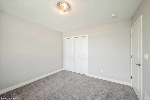 2740 Burns Dr, Marion, IA 52302 - unfurnished bedroom featuring carpet flooring, baseboards, and a closet