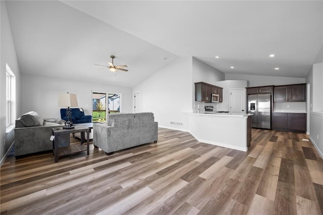 3850 Quail Trail Dr, Marion, IA 52302 - living room featuring lofted ceiling, a ceiling fan, wood finished floors, and recessed lighting