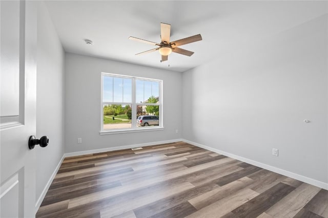 3850 Quail Trail Dr, Marion, IA 52302 - unfurnished room with a ceiling fan, wood finished floors, baseboards, and a smoke detector