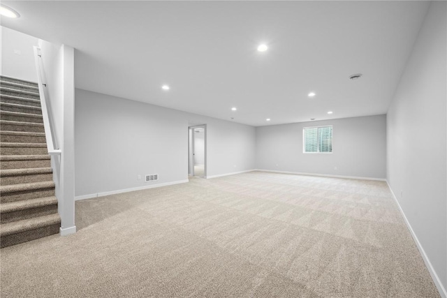 3850 Quail Trail Dr, Marion, IA 52302 - basement with light colored carpet, recessed lighting, stairs, and baseboards