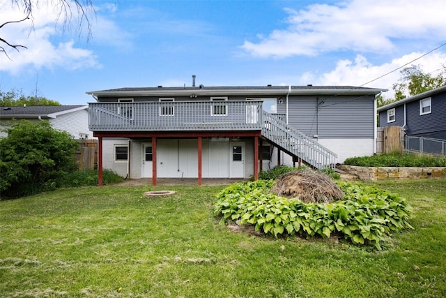back of property featuring a wooden deck, stairs, and brick siding